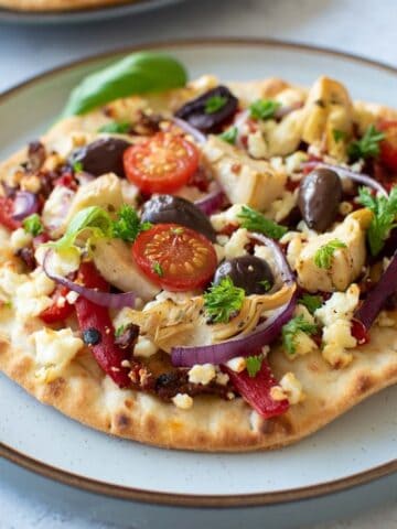 Mediterranean flatbread on a plate.