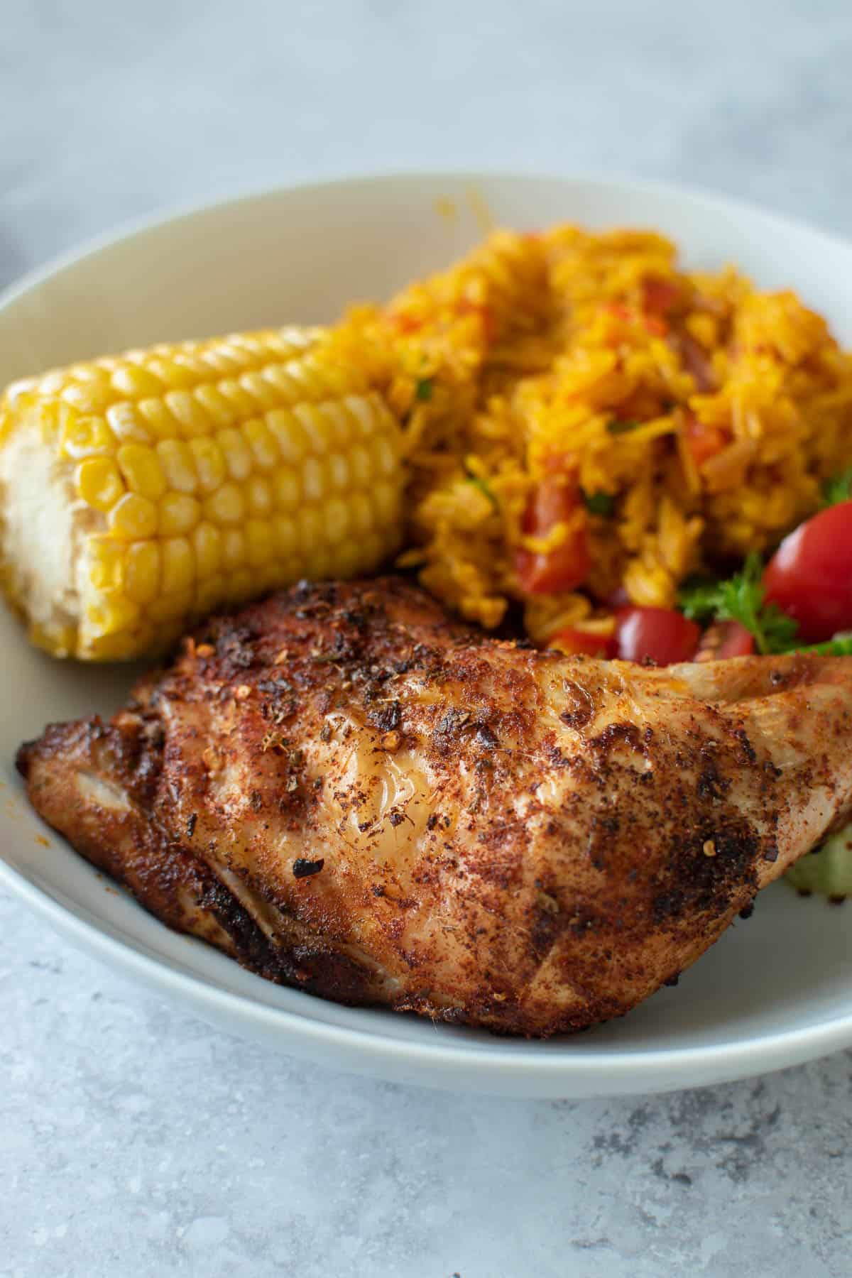 Close up of a baked chicken leg.