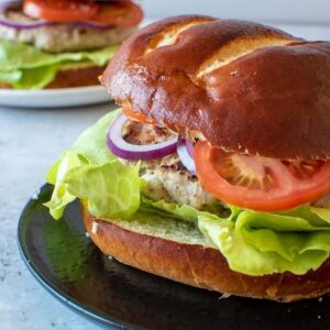 Close up of a pork and apple burger.