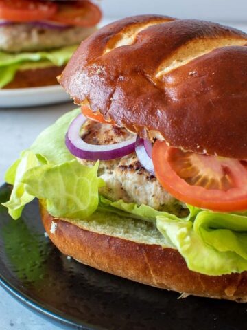 Close up of a pork and apple burger.
