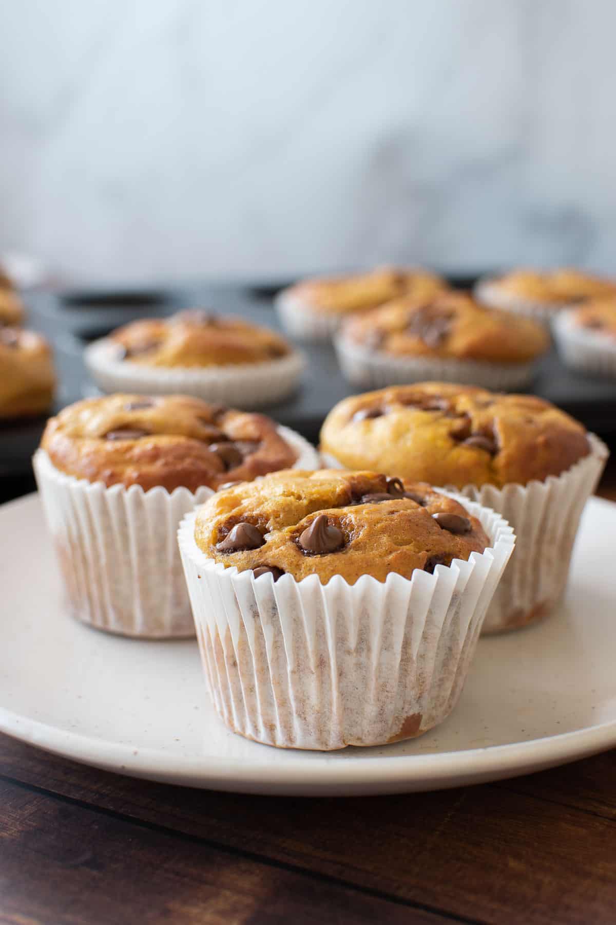 Pumpkin muffins on a plate.