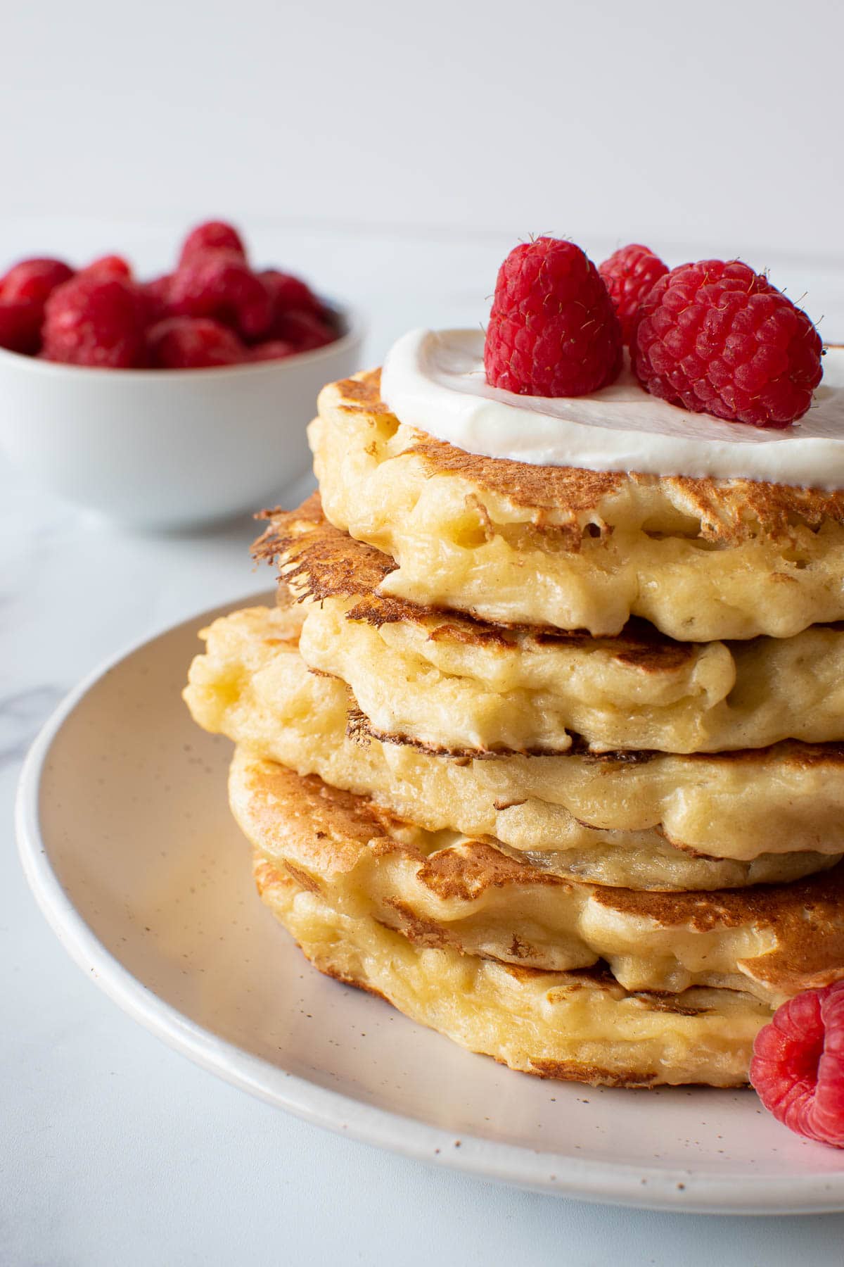 A stack of quark pancakes on a plate.