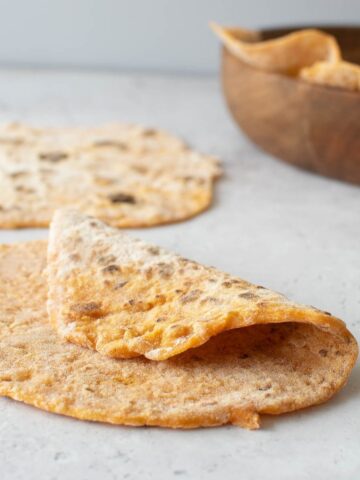 A folded flatbread on a table.