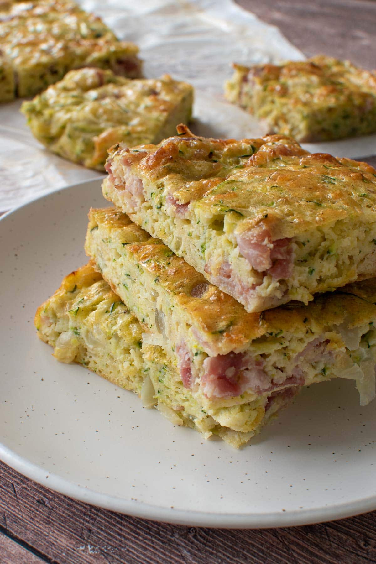 A plate of zucchini slices, with more in the background.