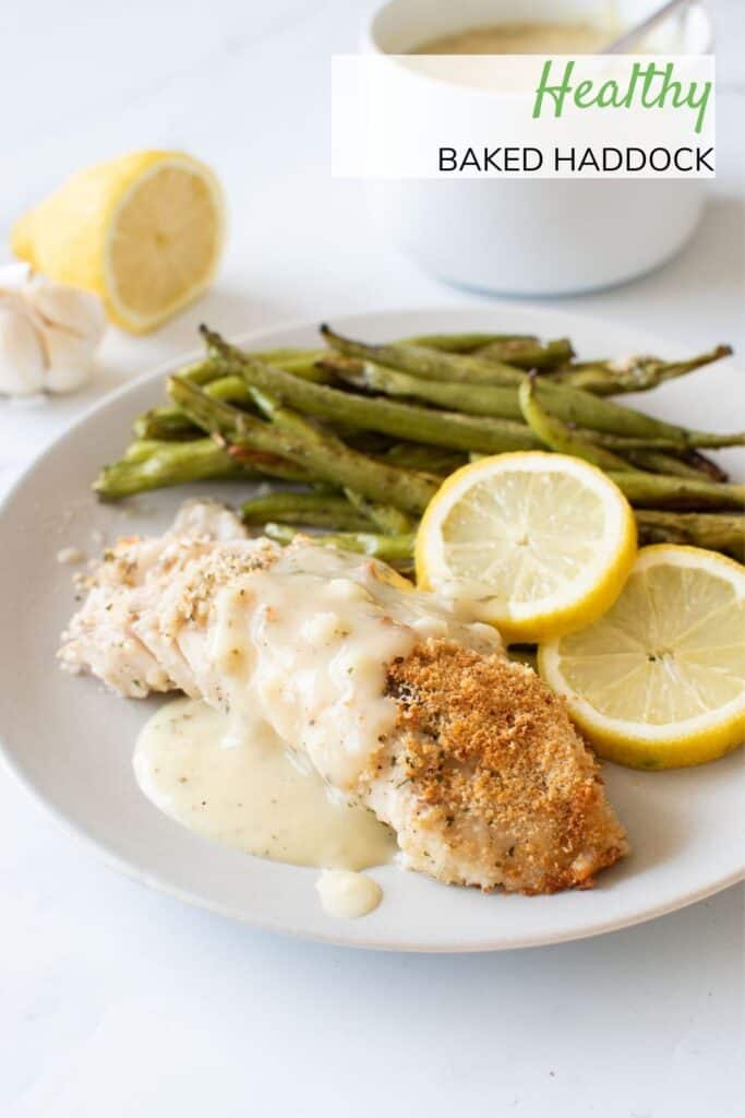 Baked haddock with lemon sauce and green beans.