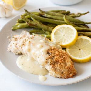 Lemon sauce over baked haddock.