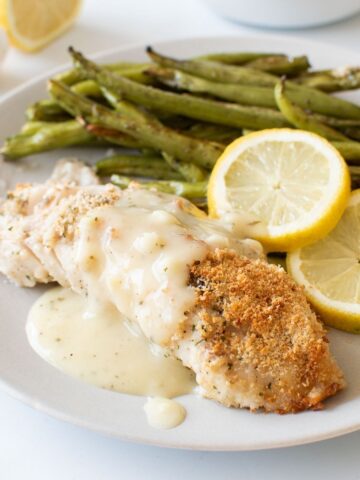 Lemon sauce over baked haddock.