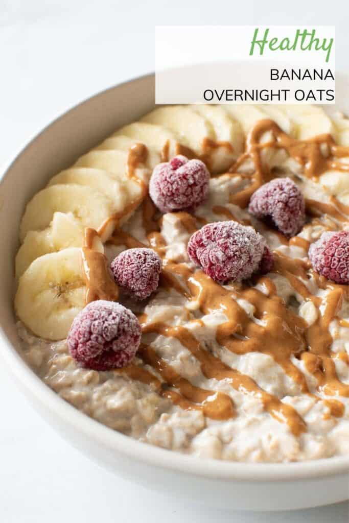 A bowl of overnight oats with bananas, peanut butter and raspberry.