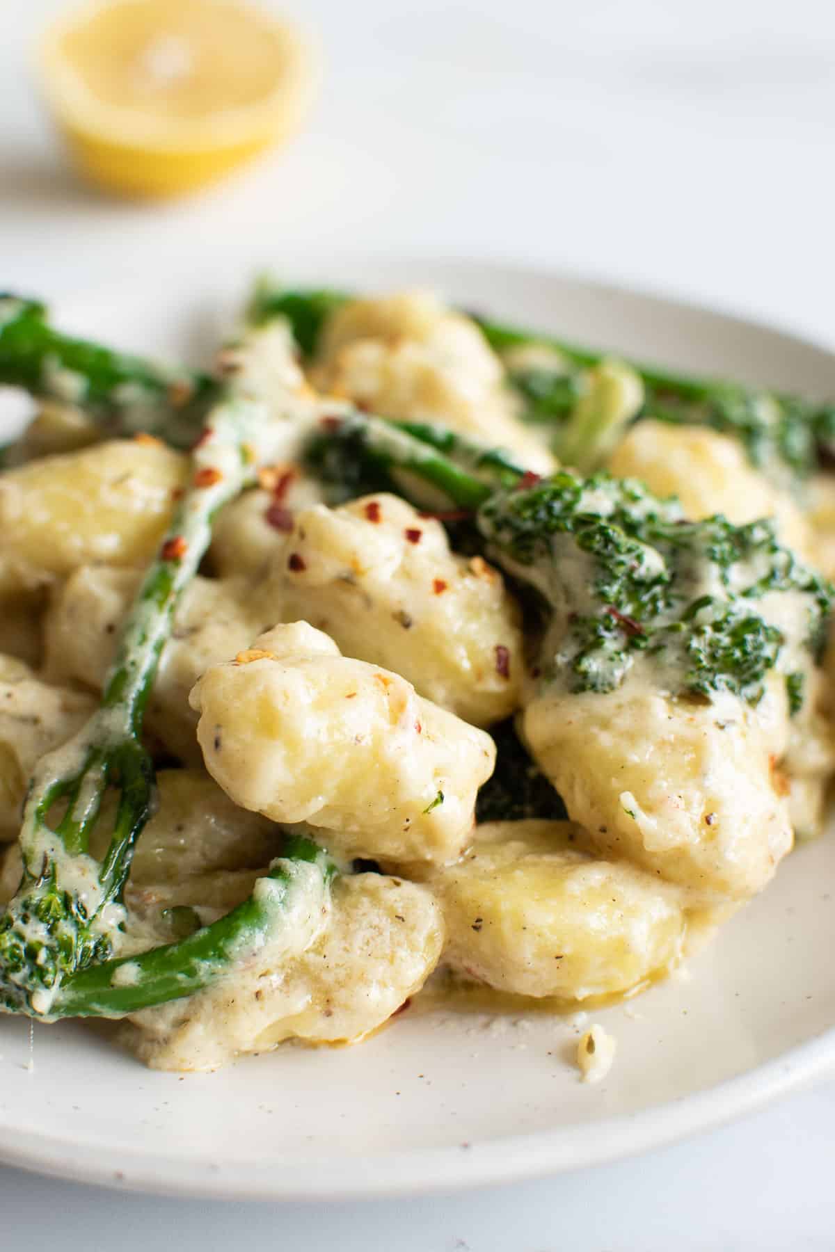 Close up of broccoli and cheese gnocchi.