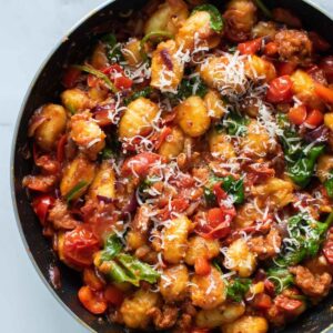 Chorizo gnocchi in a skillet.