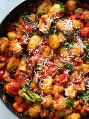 Chorizo gnocchi in a skillet.