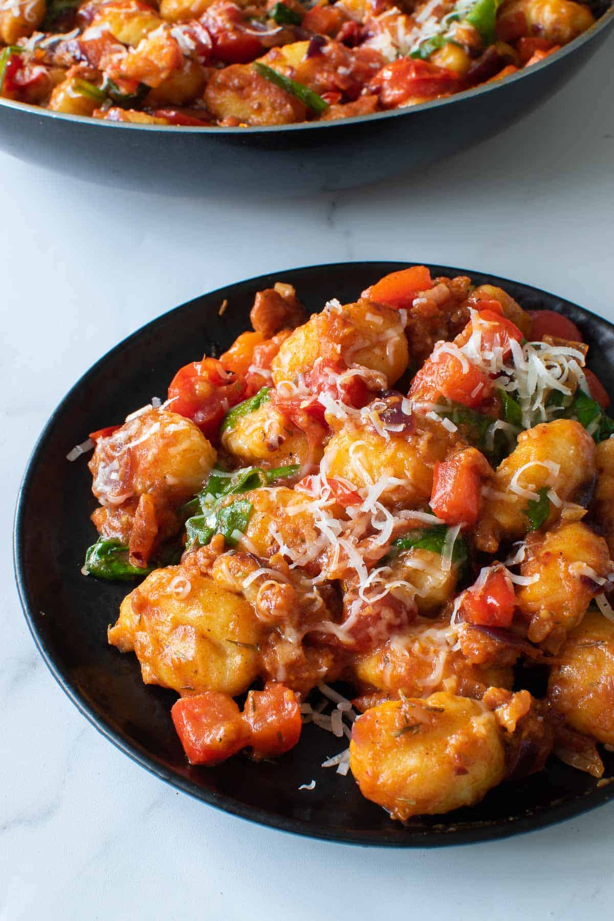 Close up of a serving of chorizo gnocchi.