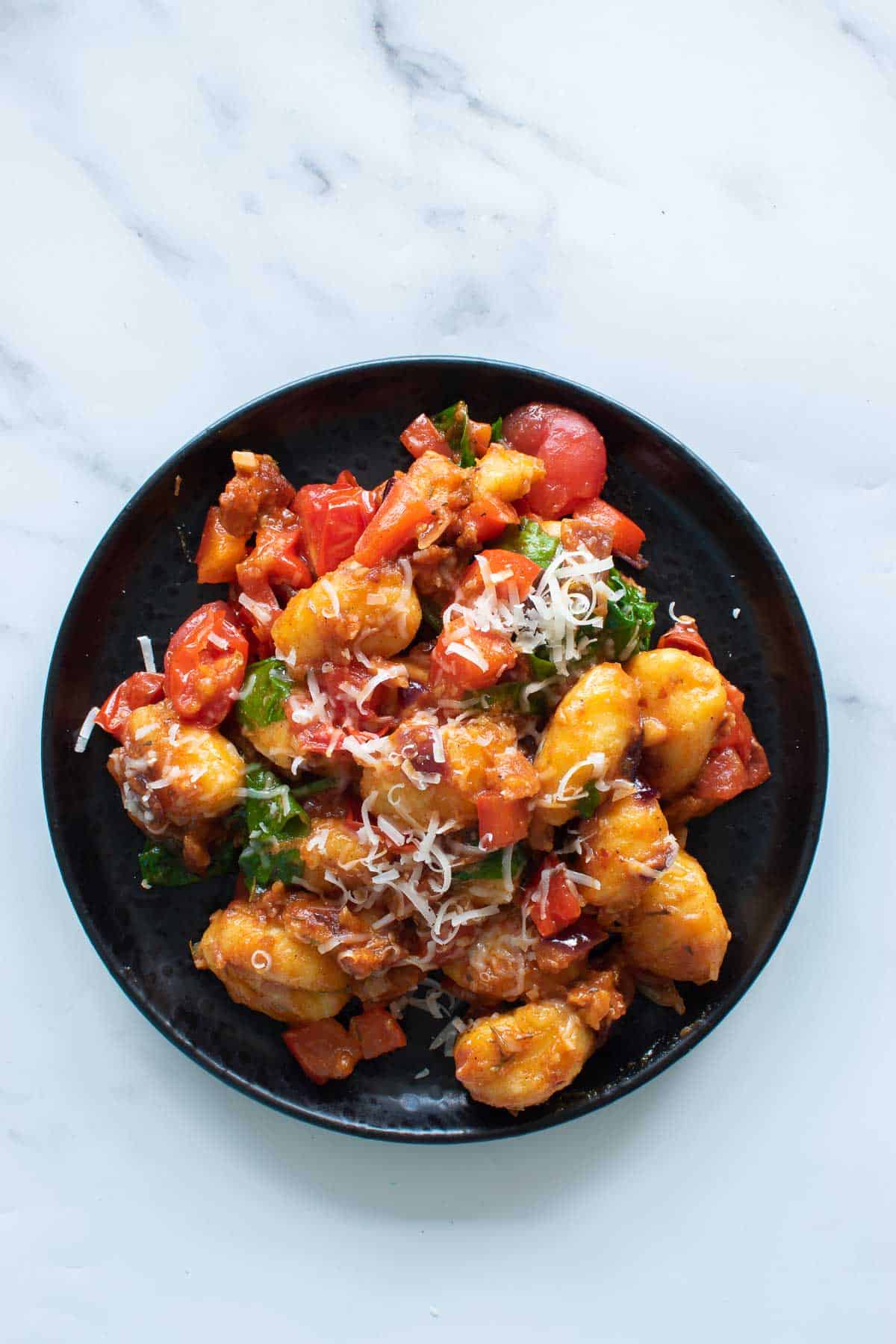 A plate of chorizo gnocchi.