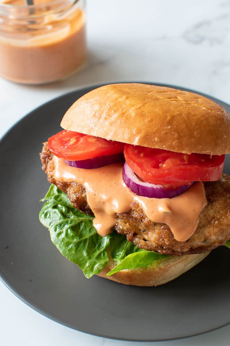 A chicken burger with spicy burger sauce.