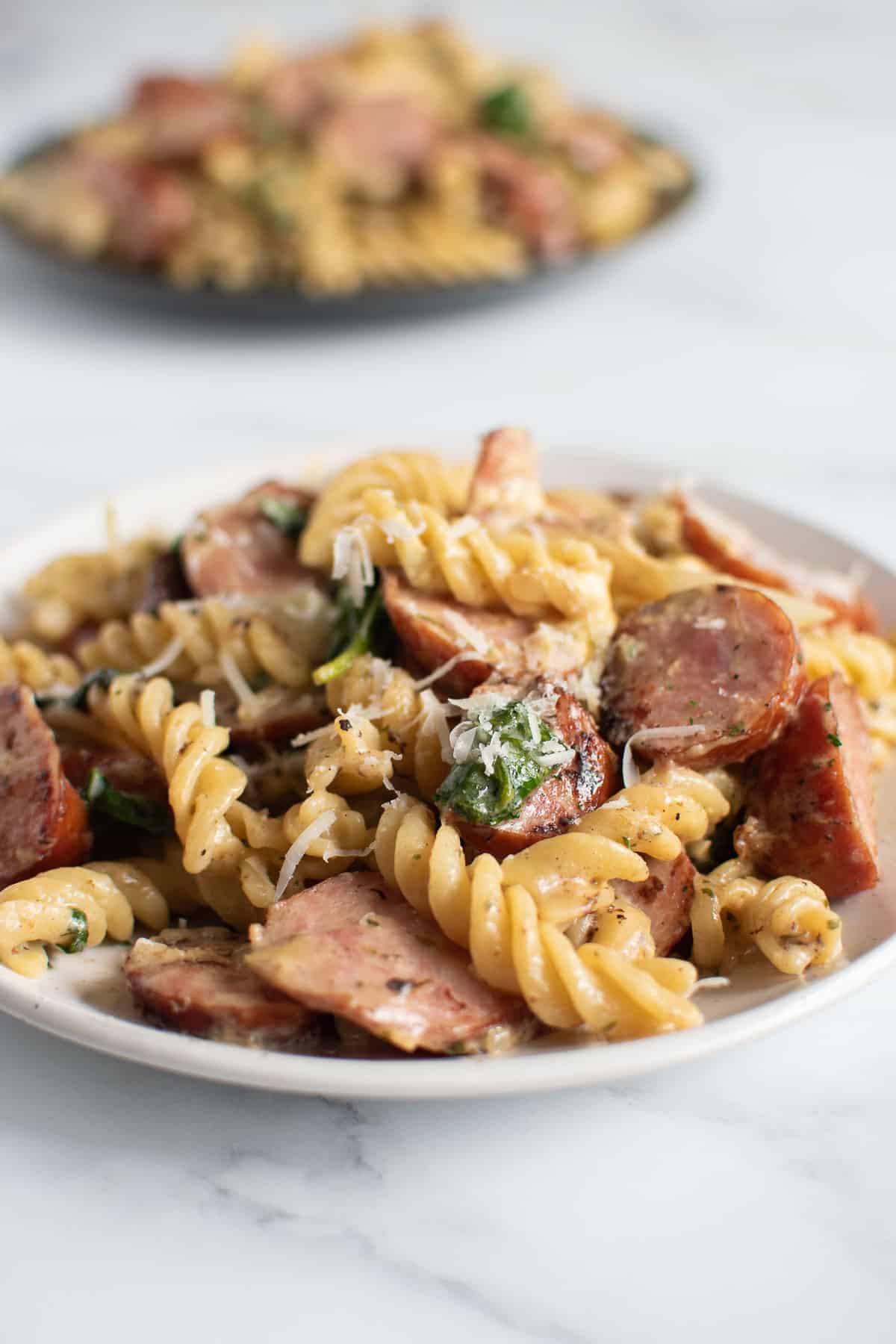 Close up of a plate of kielbasa pasta.