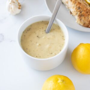 Lemon garlic sauce with lemon on the side.