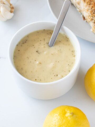 Lemon garlic sauce with lemon on the side.