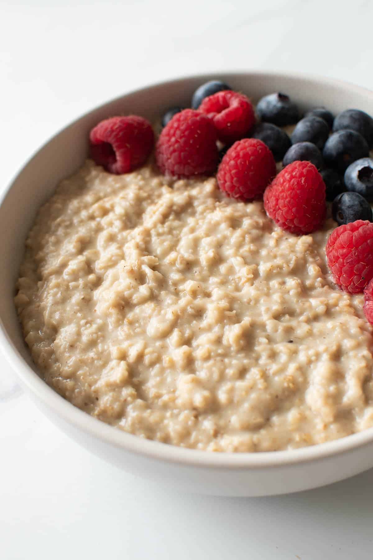 Breakfast porridge with berries on top.