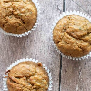 Three pumpkin zucchini muffins.