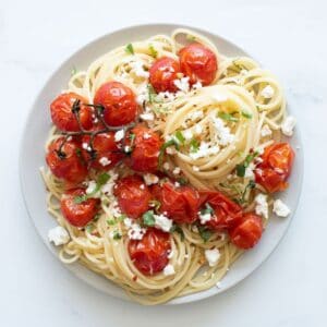 Spaghetti with roasted cherry tomatoes, feta and basil.