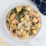 Salmon gnocchi with spinach and Parmesan cheese.