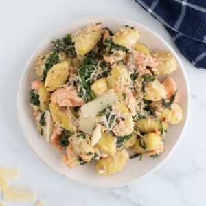 Salmon gnocchi with spinach and Parmesan cheese.