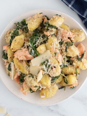 Salmon gnocchi with spinach and Parmesan cheese.