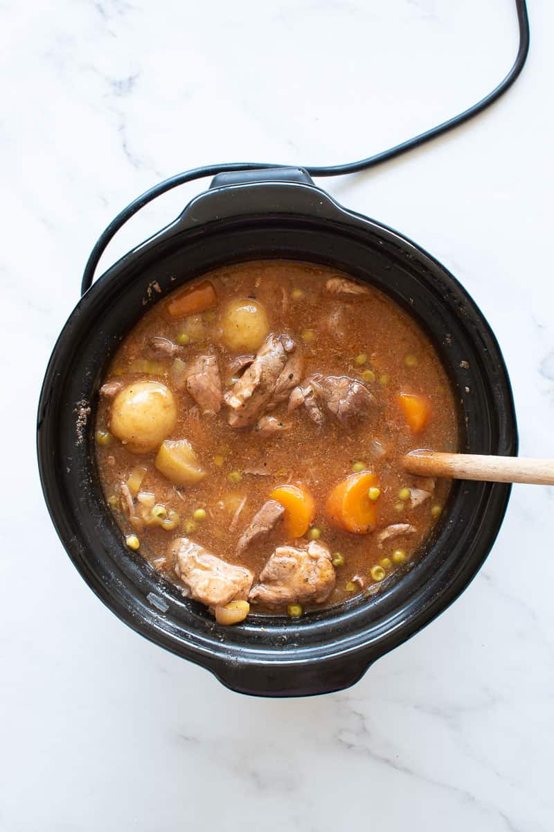 A slow cooker with pork casserole.