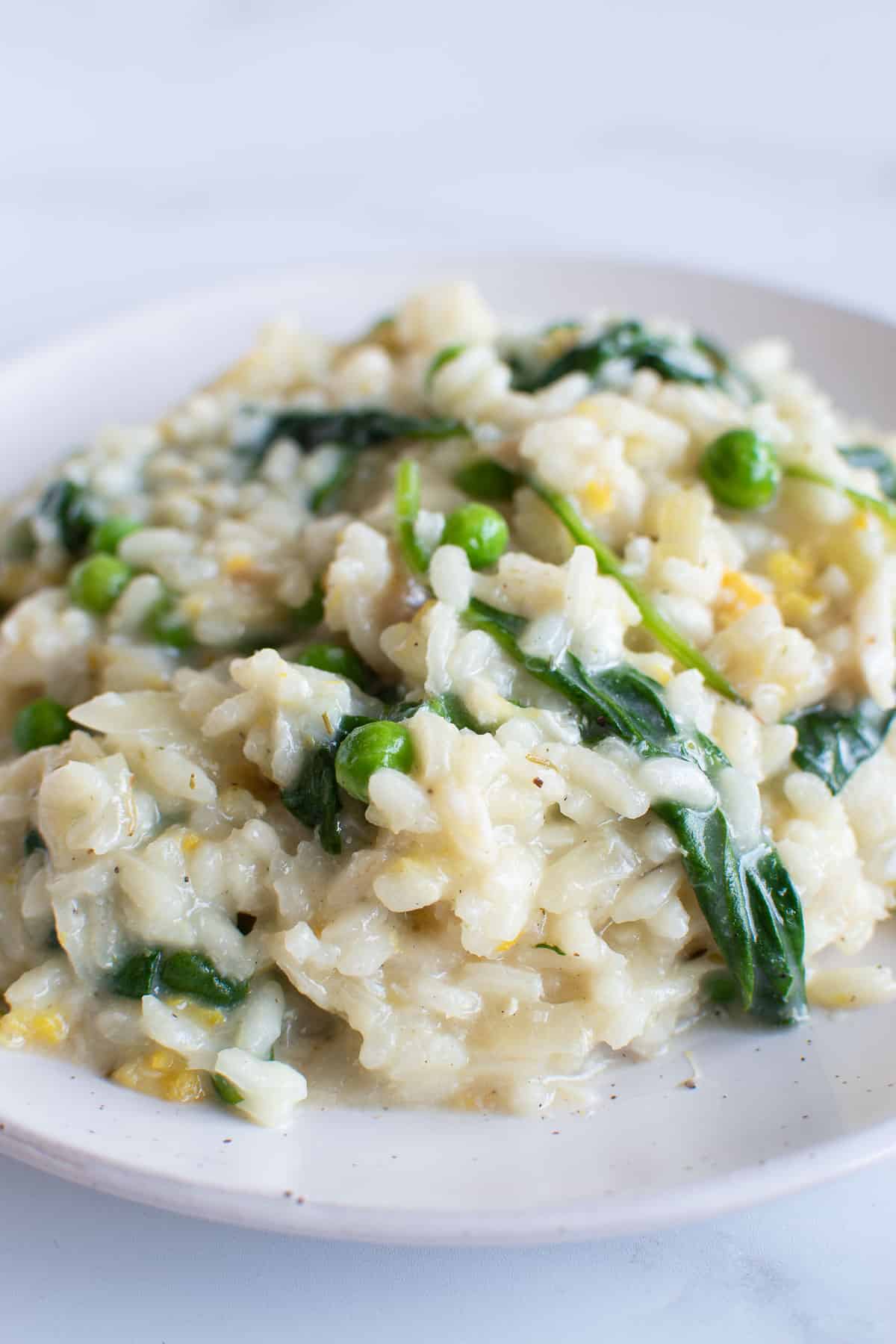 Smoked haddock risotto with peas and spinach.