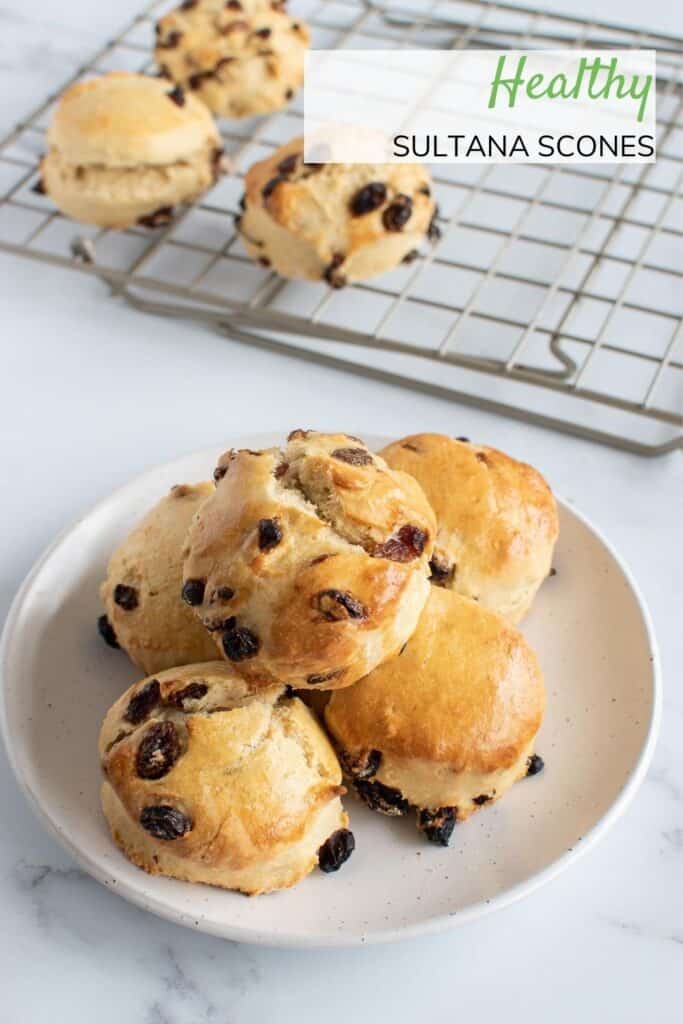 Scones with sultanas on a plate.