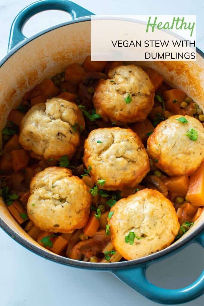 A pot of vegan stew with dumplings.