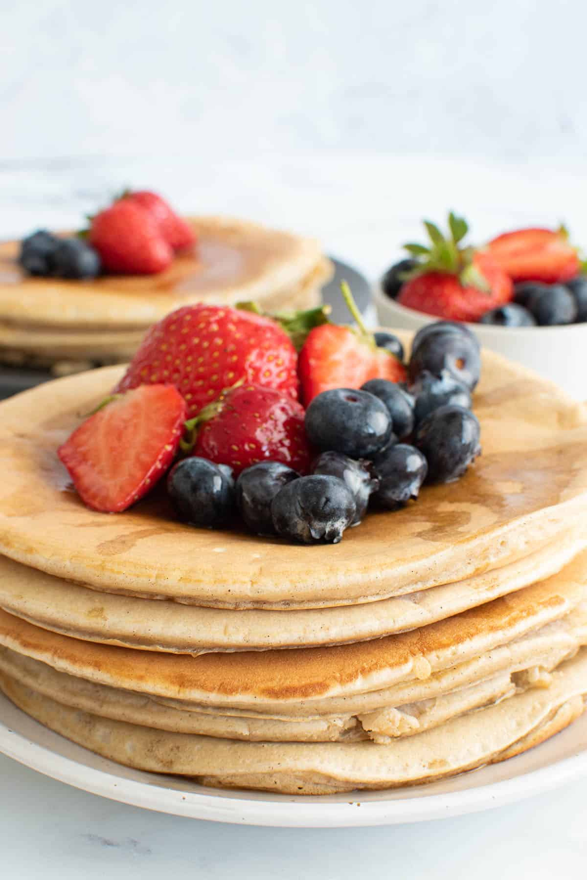 A stack of thick pancakes made with oat milk.