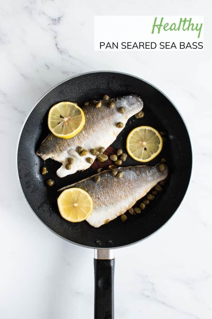 Sea bass, lemon and capers in frying pan.