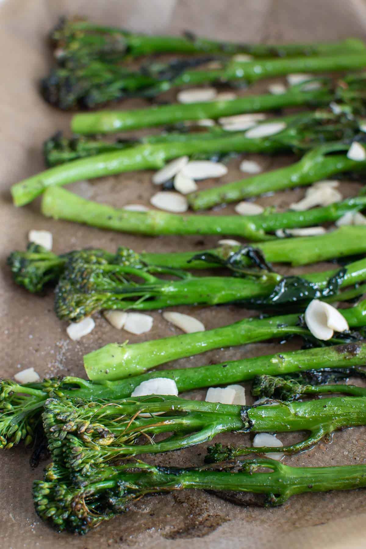 Close up of roasted broccolini with almonds.