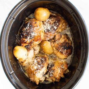 Slow cooker garlic Parmesan chicken and potatoes.