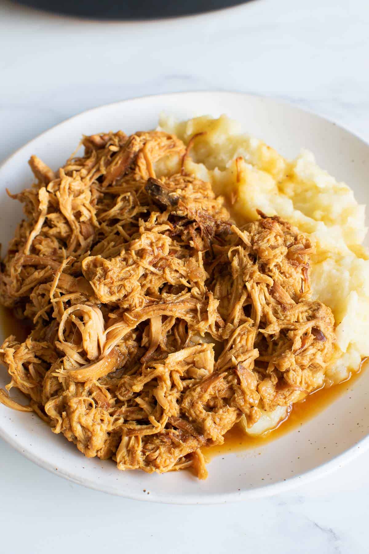 Shredded honey mustard chicken with mashed potatoes.