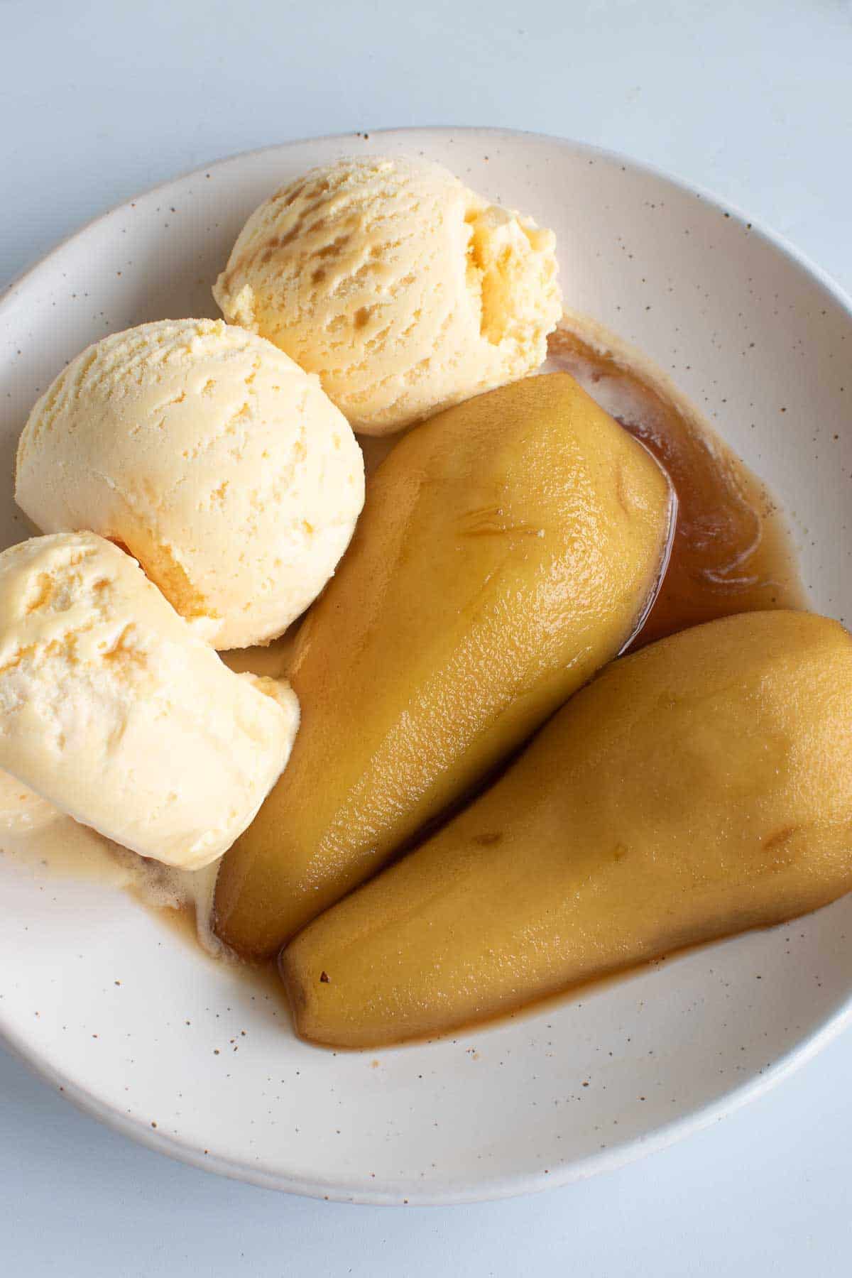 Brandied pears with ice cream.