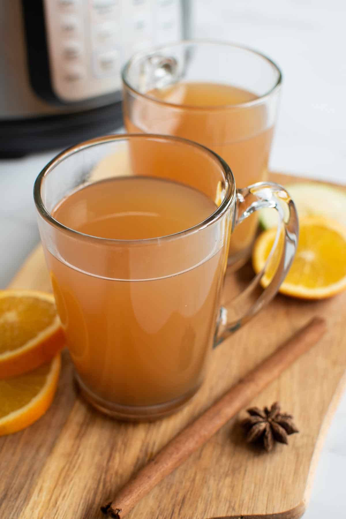 Two glasses of Instant Pot mulled apple cider.