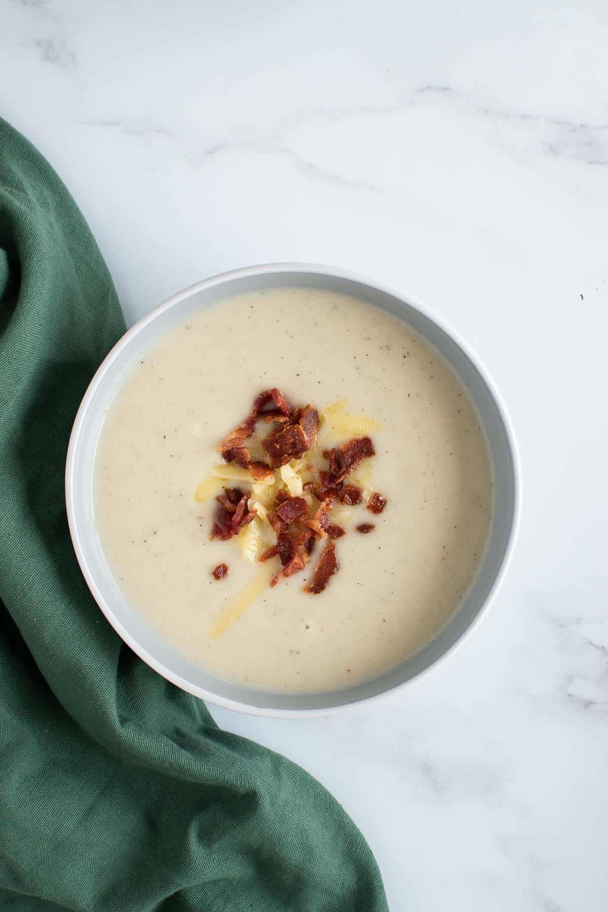 Pressure cooked cauliflower soup in a bowl.