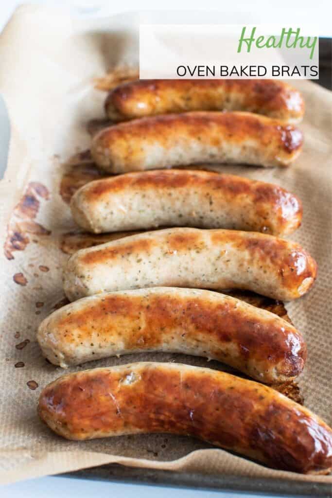 Baked sausages on a sheet pan.