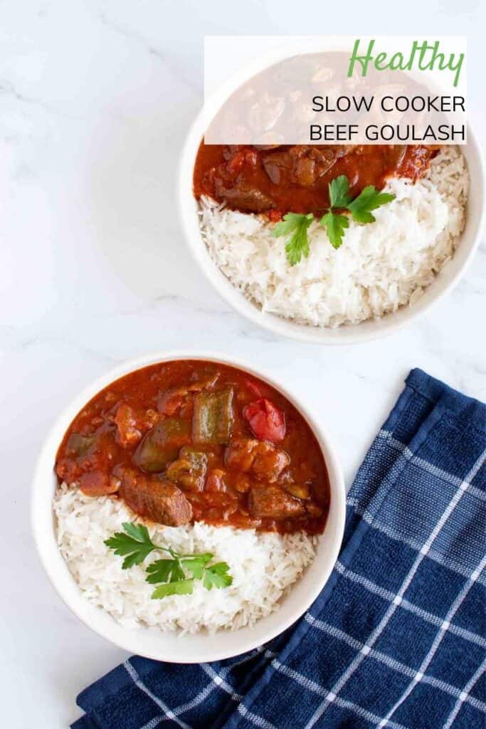 Two bowls of slow cooker beef goulash and rice.