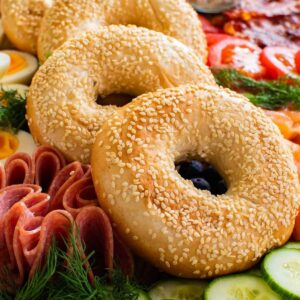 Bagel board with sesame bagels.