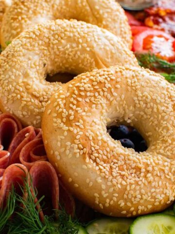 Bagel board with sesame bagels.