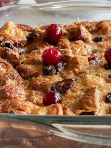 Eggnog bread pudding with cranberries and raisins.