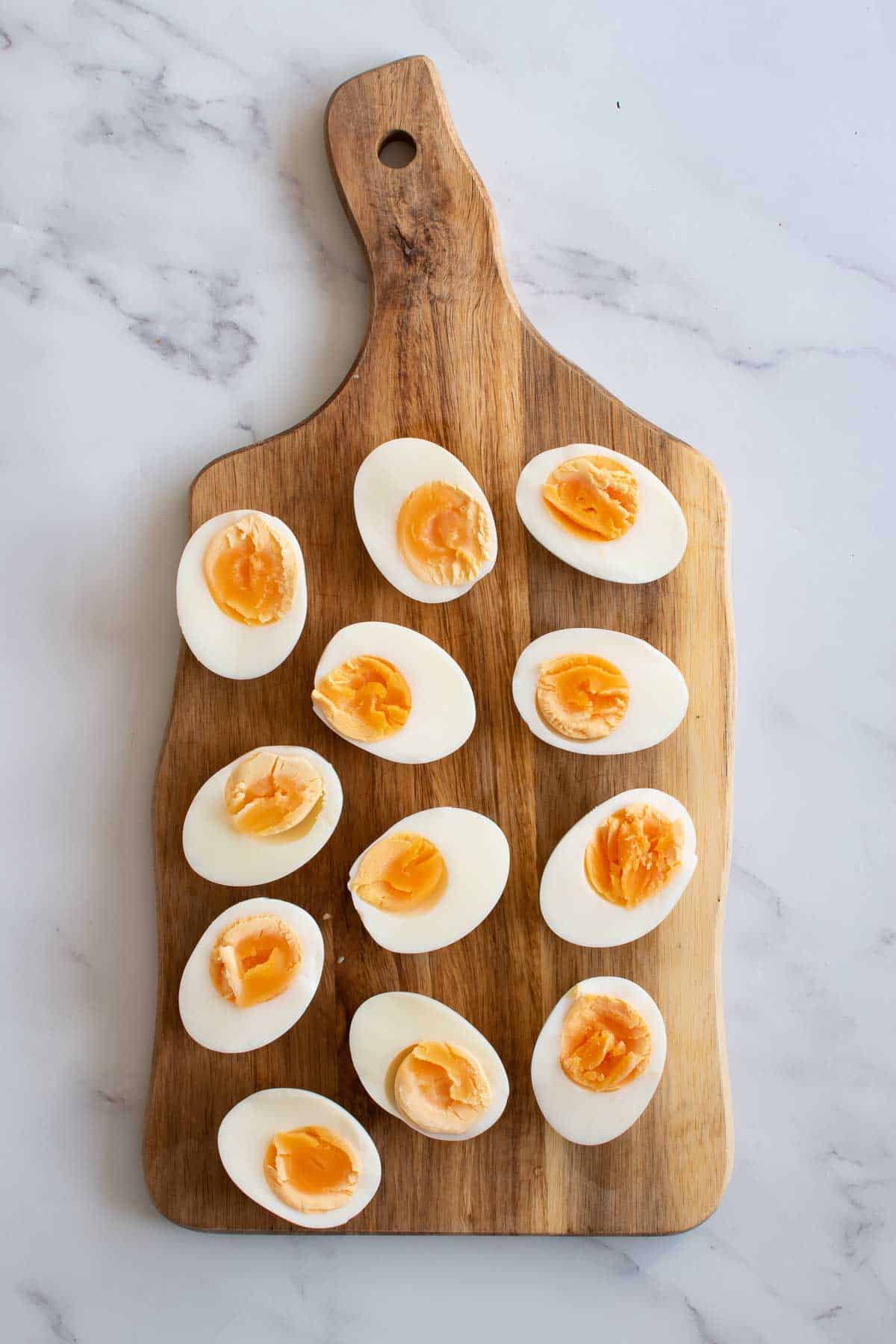 Instant Pot hard boiled eggs on a cutting board.