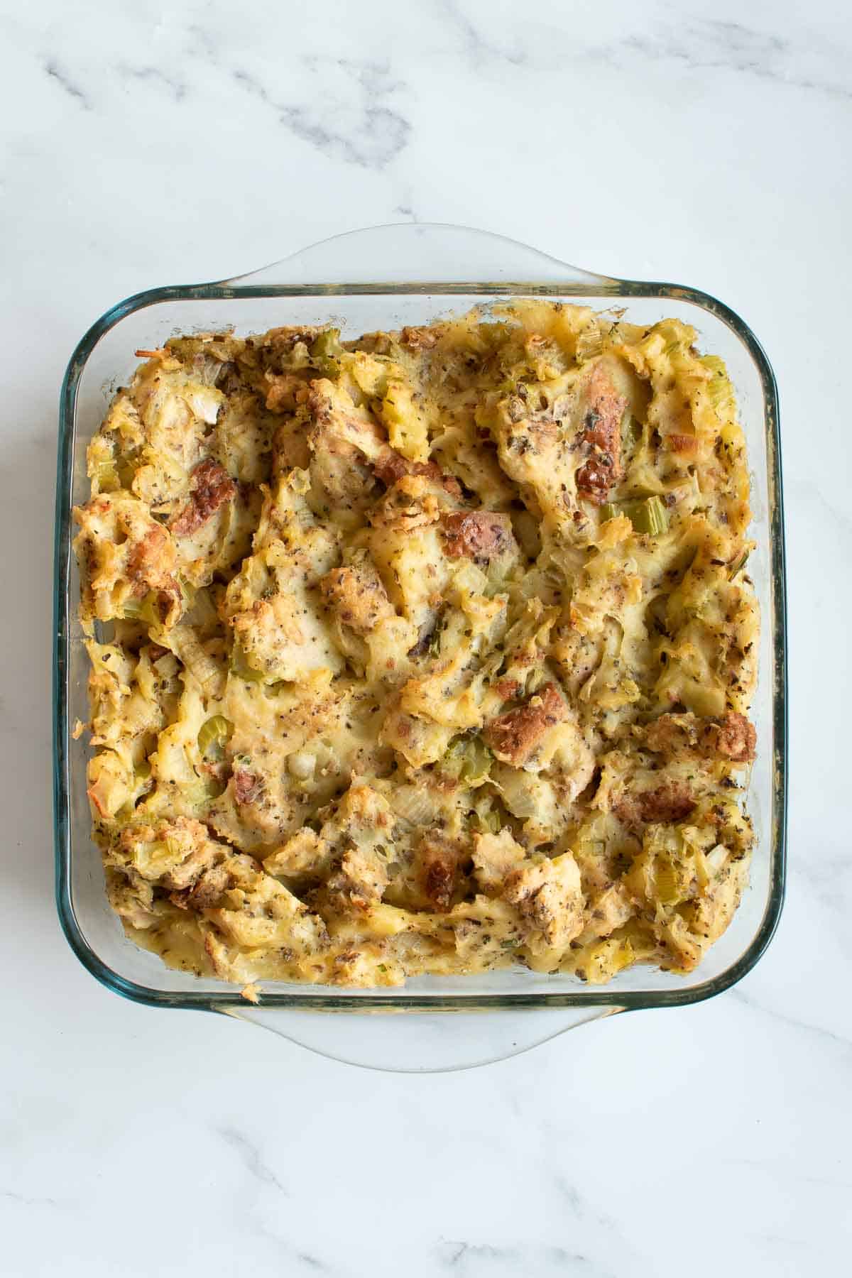 Bread and mashed potato stuffing in a casserole dish.