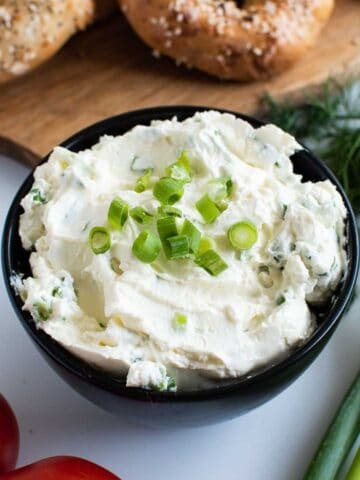 Scallion cream cheese in a bowl.