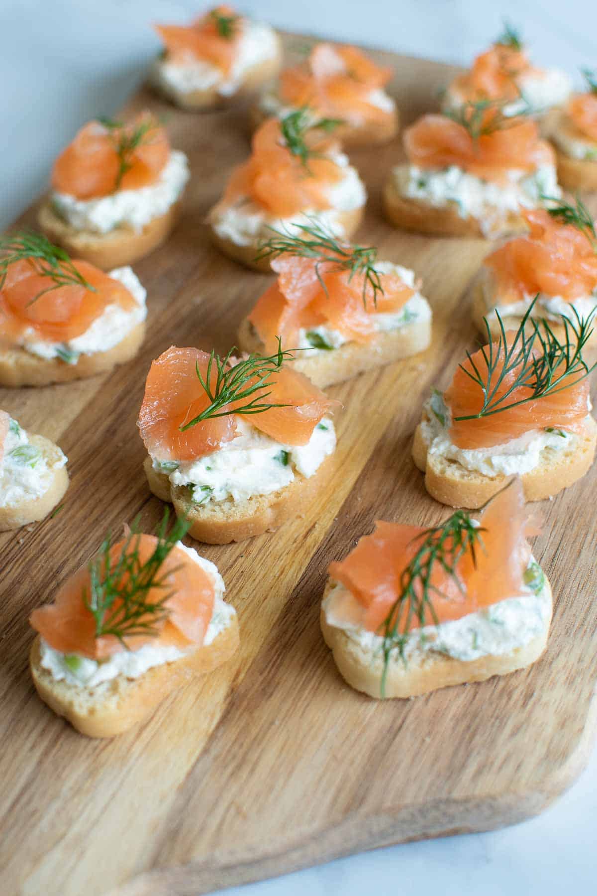 Smoked salmon bites with cream cheese and crostini.