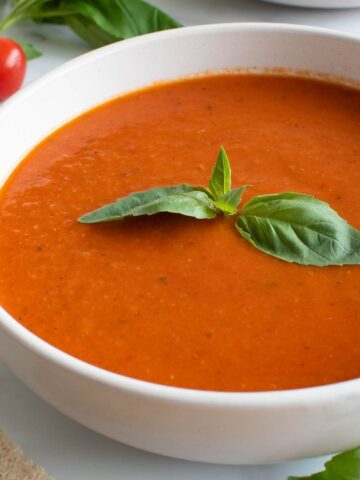 Spicy tomato soup with basil and red pepper flakes.