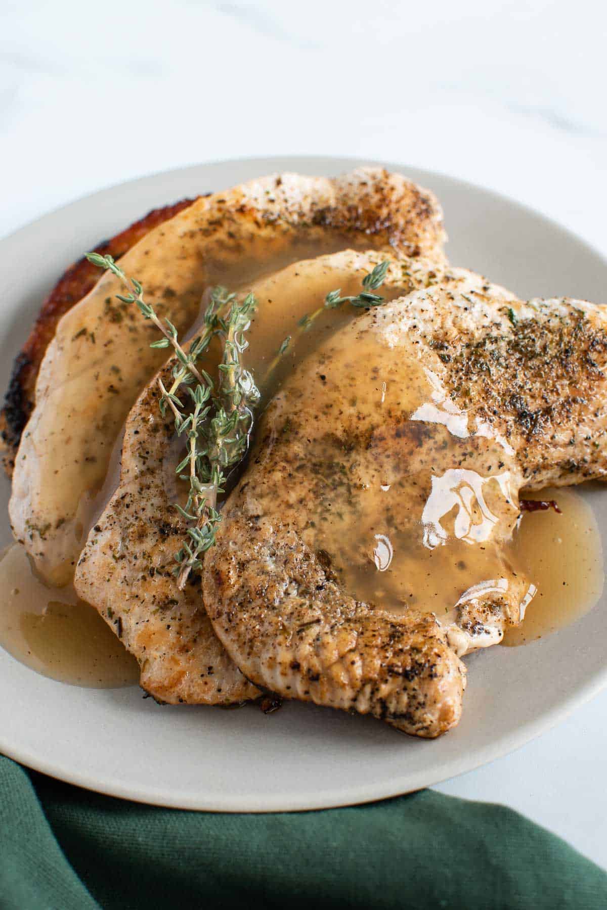 Turkey steaks with gravy.